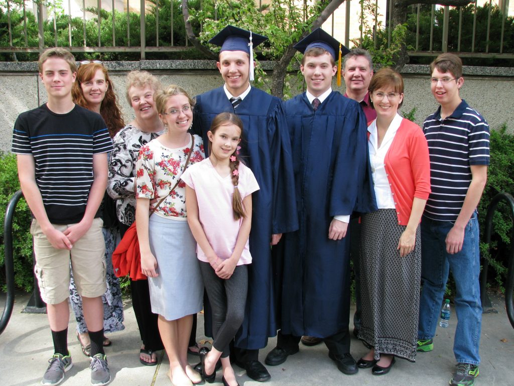 Family picture at two sons' college graduation, both having been mostly homeschooled