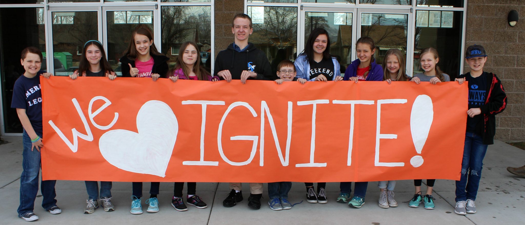 Students holding a sign that says We Love Ignite!