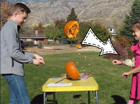 pumpkin exploding in half from pressure of rubber bands on it