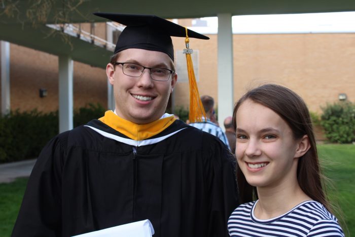 college graduate with his sister